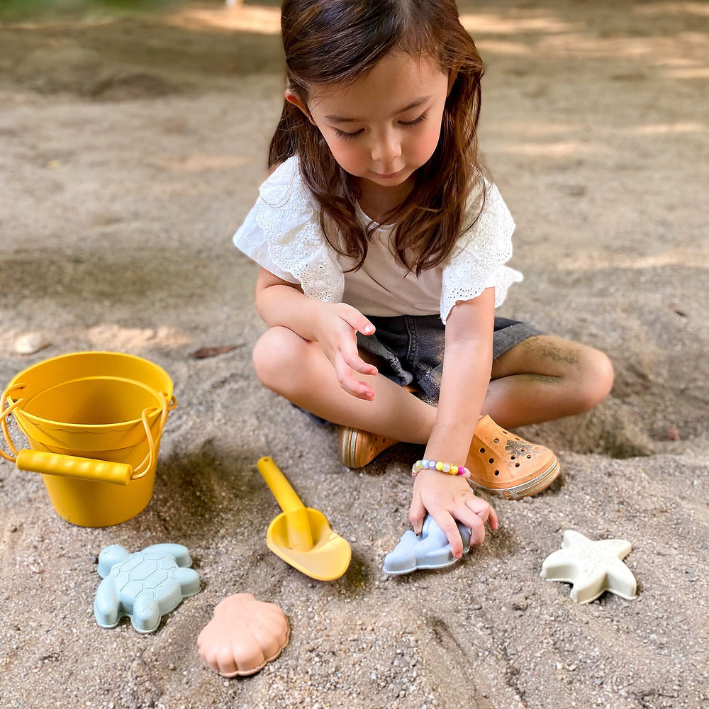 Blue Ginkgo cotton mesh tote bag keeps toys organized.