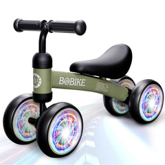 Bobike baby balance bike in colorful deep green helps early balance exploration.