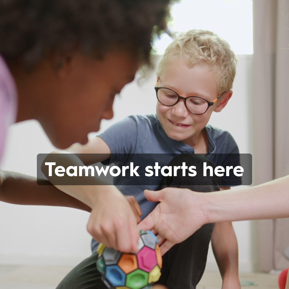 BOULDERBALL Group teamwork play demonstrates communication and collaborative problem solving.