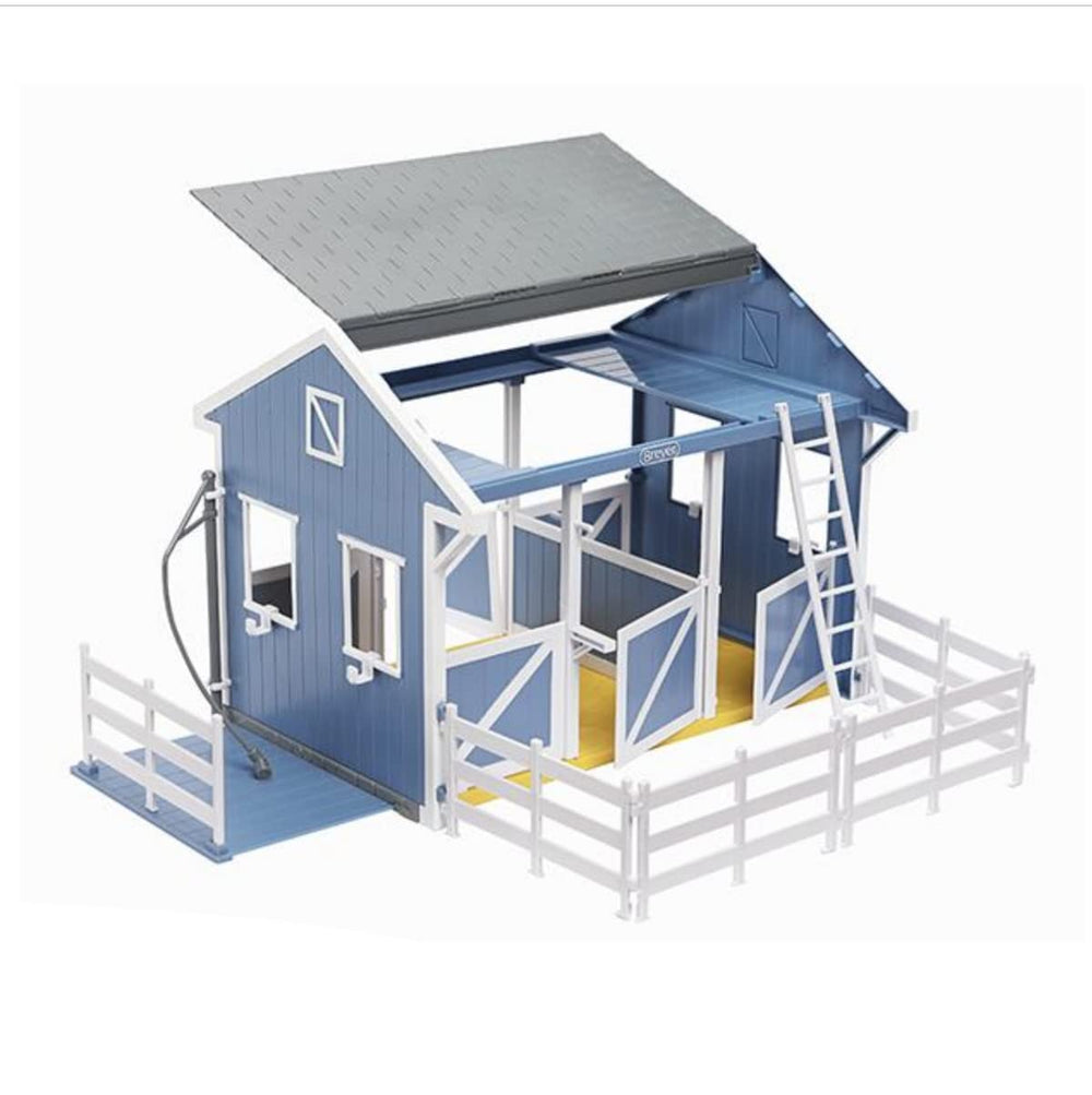 Stable roof open on both sides providing easy access to three stalls.