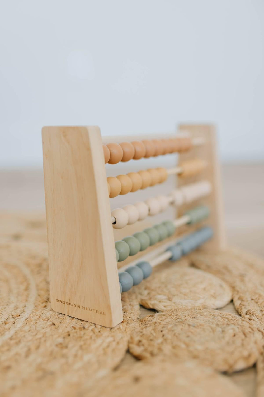Brooklyn Neutral Boho Abacus used by kids during hands-on math games.