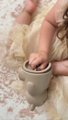 Brooklyn Neutral silicone piggy bank offers soft touch and durability.