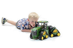 Bruder John Deere 9620RX track tractor side view, stable stance for tabletop farms.