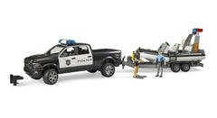 Bruder RAM 2500 police pickup with roof light and sound module for authentic emergency play.