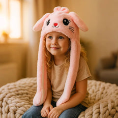 Bubblepompom Kitty Hat pink plush keeps kids warm while posing.