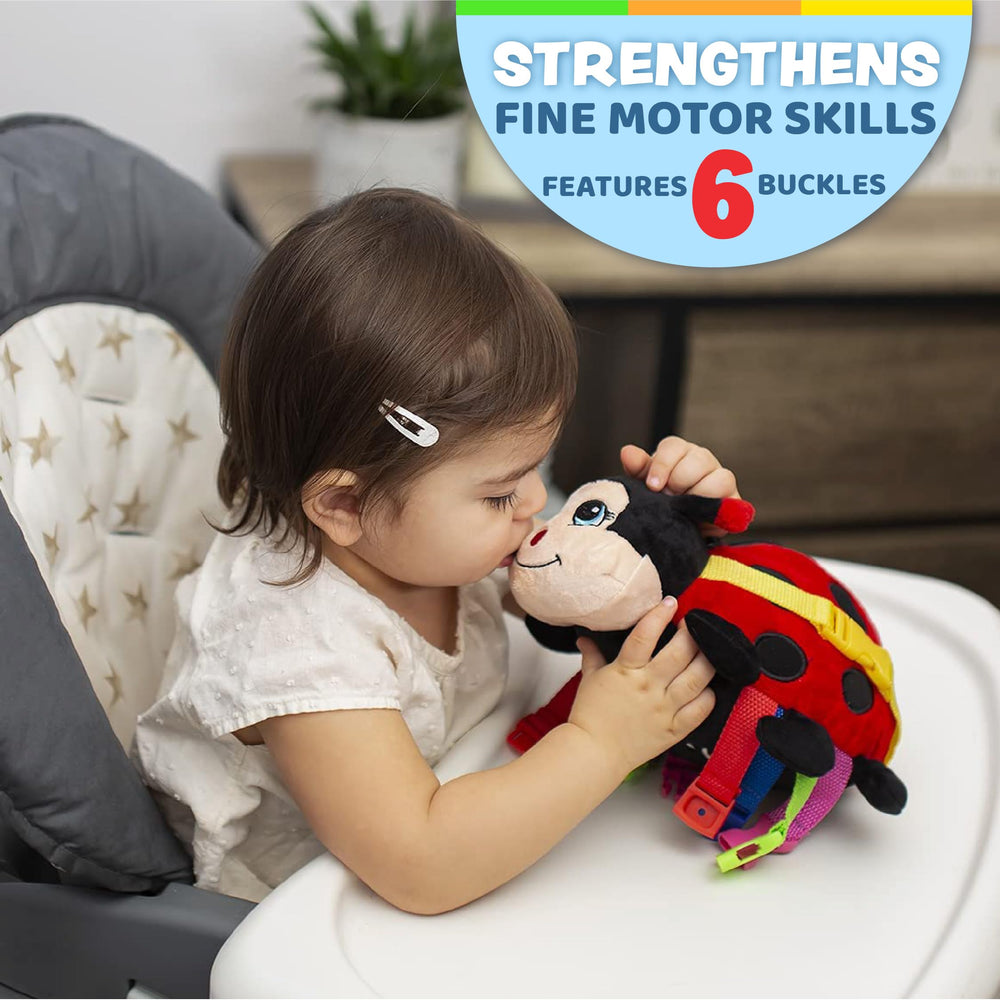 Becky Ladybug buckle-detail: tactile buckles enhance fine motor exploration.