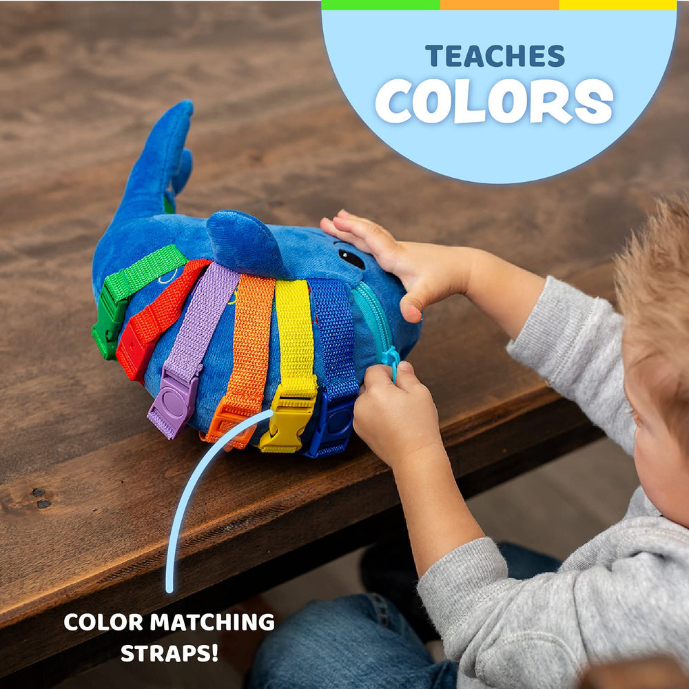 Embroidered numbers and shapes on the Blu Whale support early math awareness.