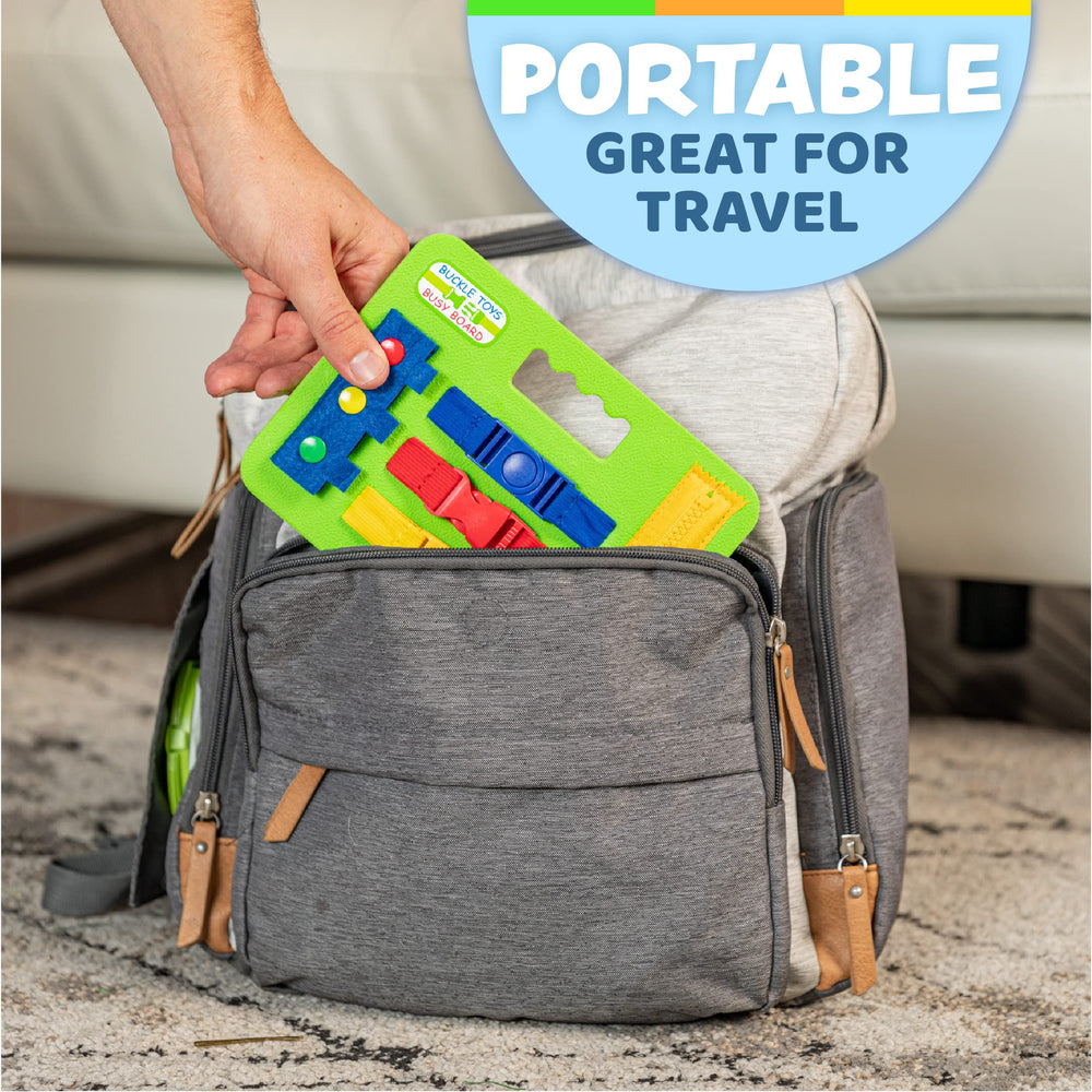 Buckle Toys mini busy board offers colorful buckles for tactile exploration and color recognition.