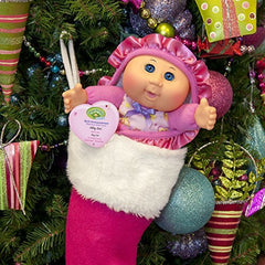 Cabbage Patch Kids doll includes an adoption birth announcement tag for memories.