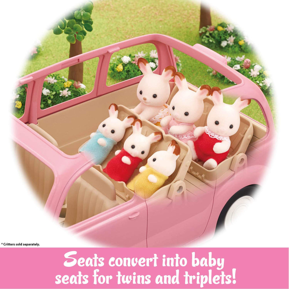 Calico Critters picnic basket with plates, croissants, cheese, and cups.
