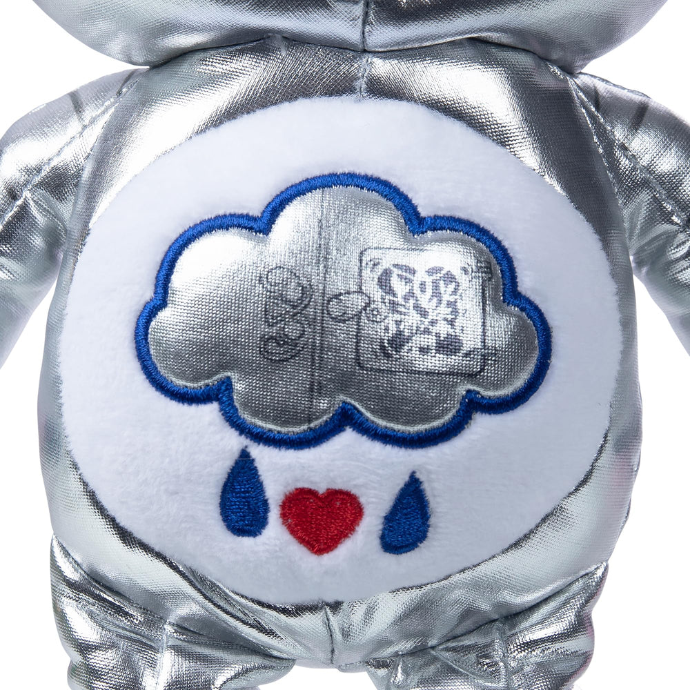 Care Bears Grumpy Bear belly badge inner workings, collectible charm for Wicked fans.