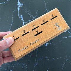 CBLKUS Penny Game coins and dice close-up, easy setup in minutes