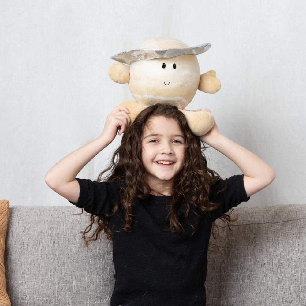 Saturn Buddy educational tag sparks curiosity about orbit concepts.