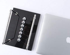 CERROPI Newton cradle detailed view reveals precise pendulum alignment.