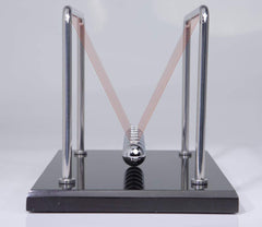 CERROPI Newton cradle in action illustrates energy transfer and play potential.