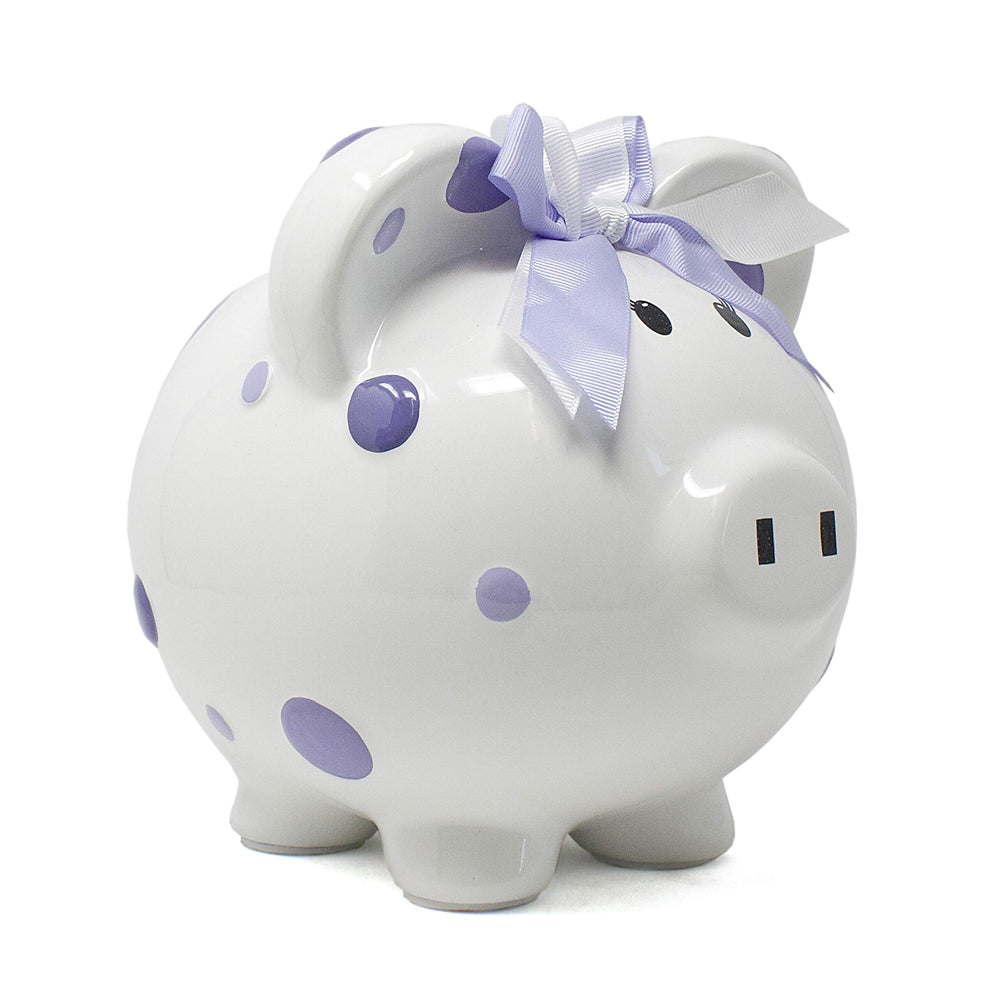 Child to Cherish piggy bank with purple polka dots promotes early saving.