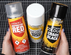 Citadel Chaos Black undercoat spray creates a neutral base for vibrant paints on models.