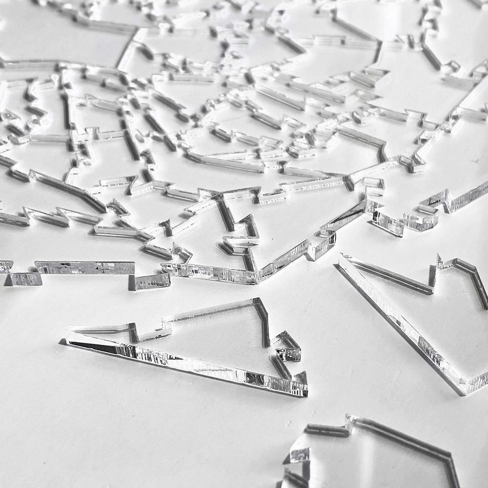 CM Originals Broken Glass Puzzle detailed pieces close-up emphasizes irregular shapes.