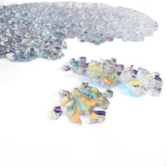 CM Originals Crystal Edition puzzle pieces spread: diverse shapes create a rigorous build experience.