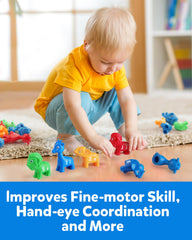 Colorful animal cards on a table create engaging color and letter sorting activities.