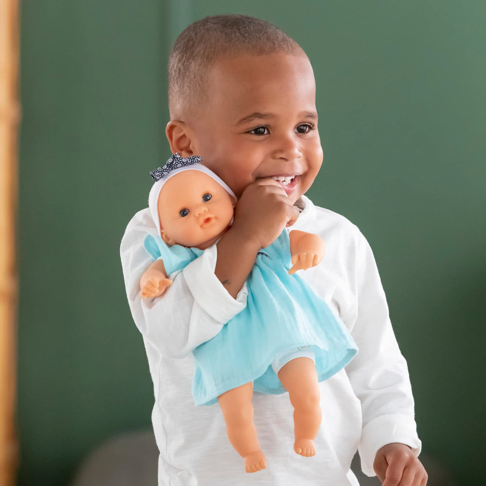 Corolle Bébé Calin Maud held in arms for comforting play.