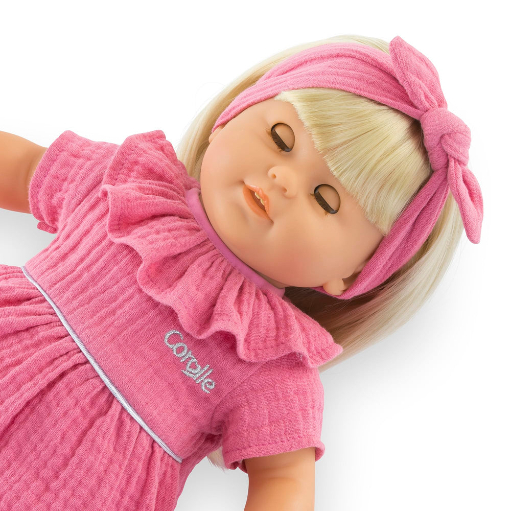 Corolle Jade cap accessory expands outfit options and imaginative play.