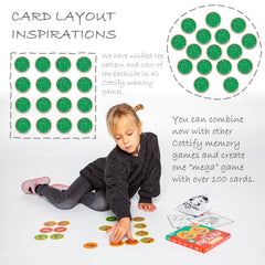Child holding a card during Cottify play to boost focus