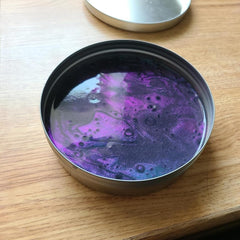 Crazy Aaron's Thinking Putty Super Scarab angle shift highlights changing colors from light.