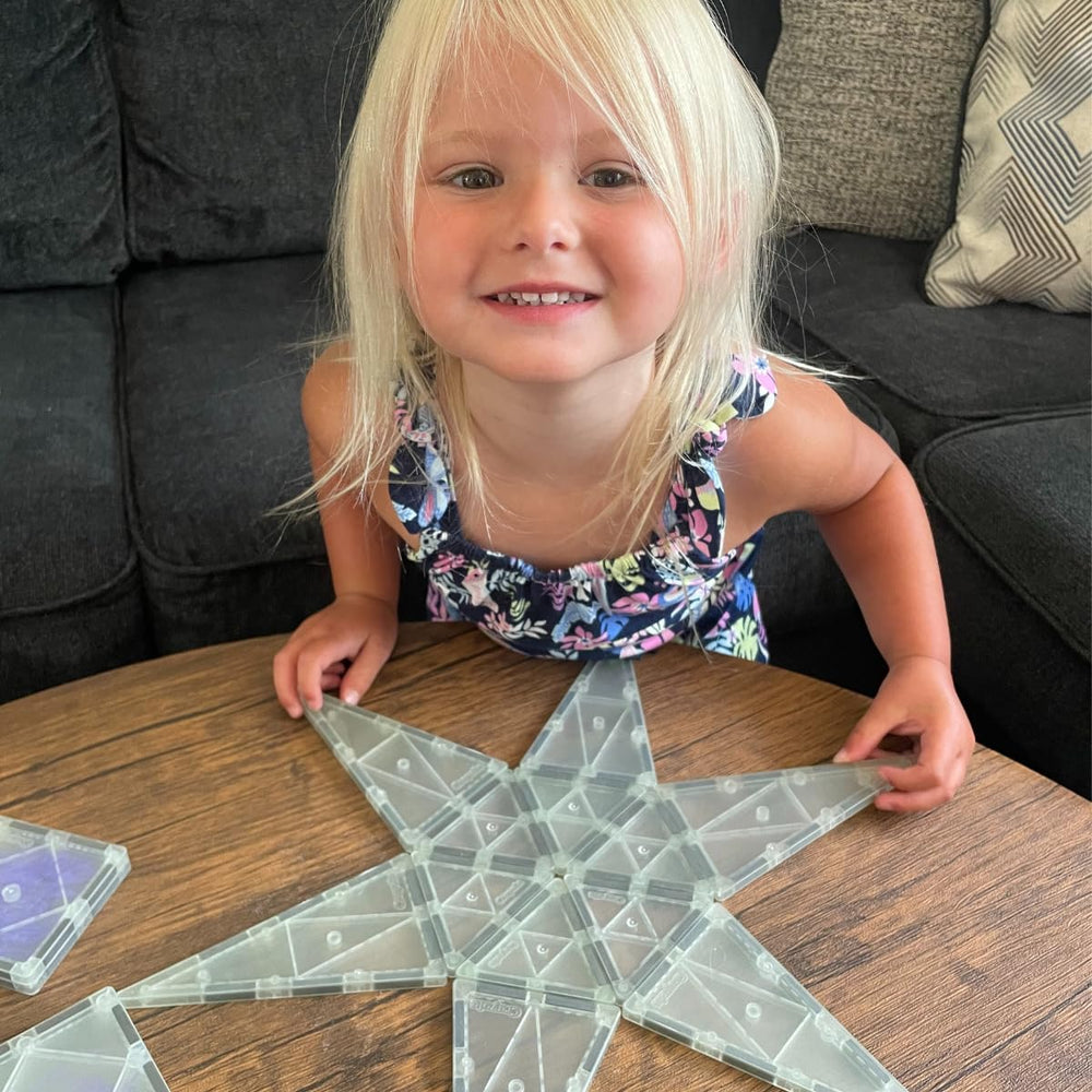 CreateOn Crayola Glow Doodle Tiles glowing in the dark for night-time play.