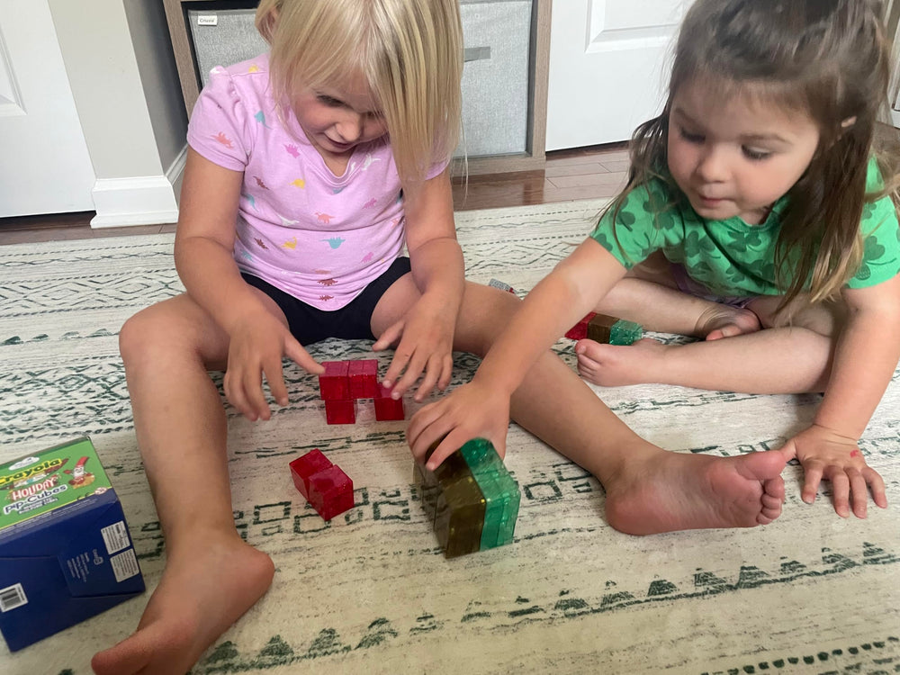 CreateOn Crayola PIP Cubes stacked into a tower showing magnetic connections.