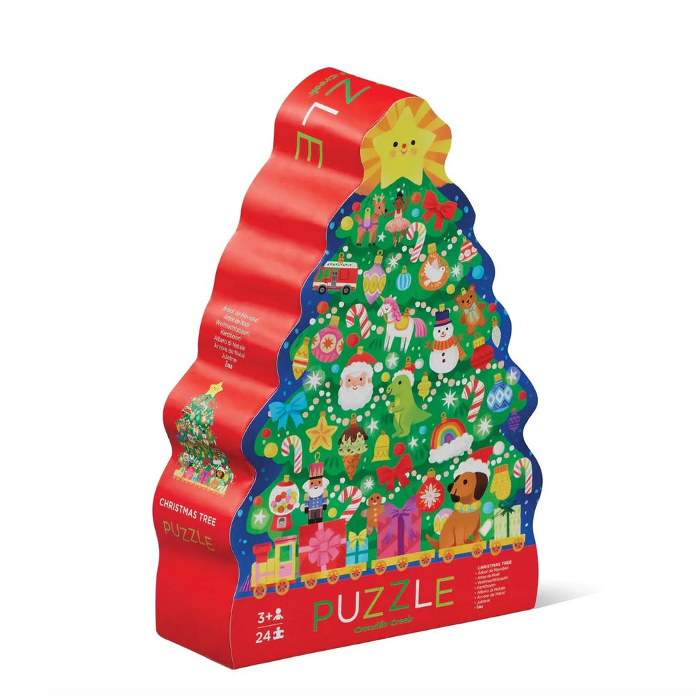 Crocodile Creek Christmas Tree 24pc puzzle on the floor, ideal for family bonding.