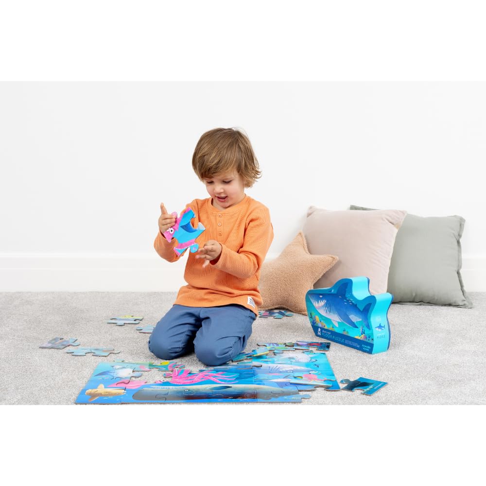 Crocodile Creek Shark Reef puzzle on the floor supports family bonding.