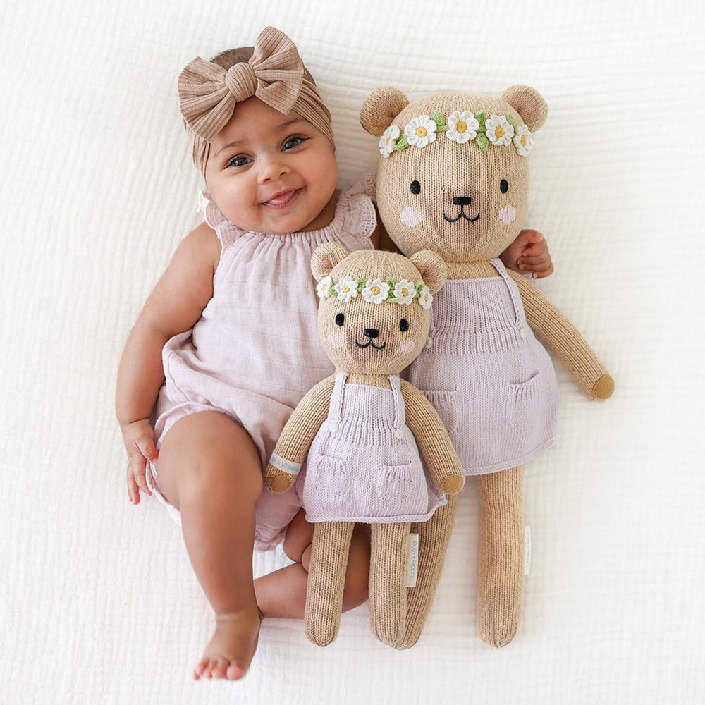 child hugging Olivia Honey Bear, showcasing heirloom toy for imaginative play