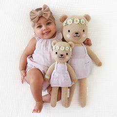 child hugging Olivia Honey Bear, showcasing heirloom toy for imaginative play