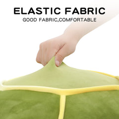 Dalmao sea turtle plush used as a pillow-style cuddle buddy.