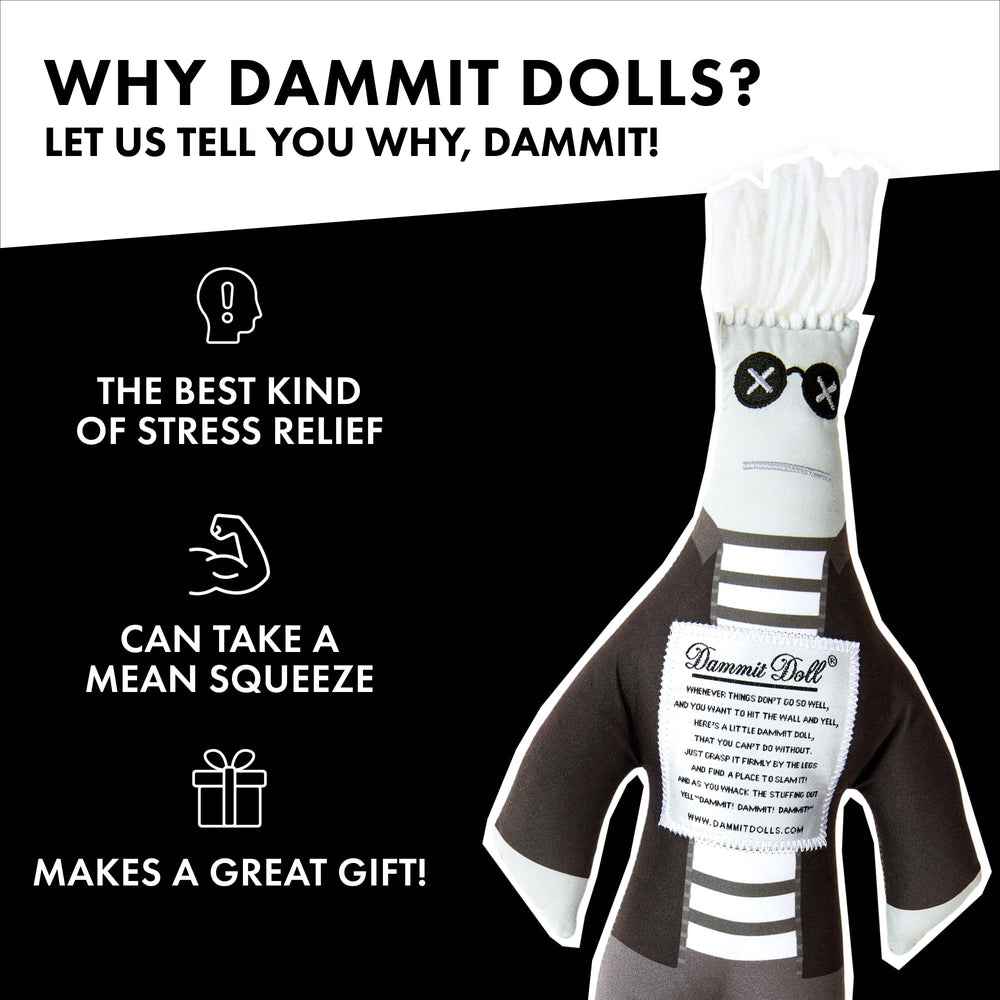Dammit Doll on desk during deadlines, a lighthearted office companion.