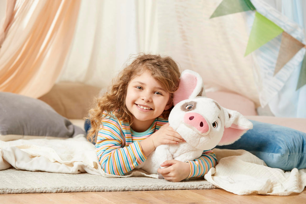 Disney Store Pua plush sized at 13 inches for easy holding.
