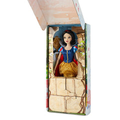 Disney Store Snow White doll displays puff sleeves and classic ensemble for timeless play.