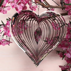 DJUAN wind spinner with stainless steel finish creates a three-dimensional glow in the breeze.