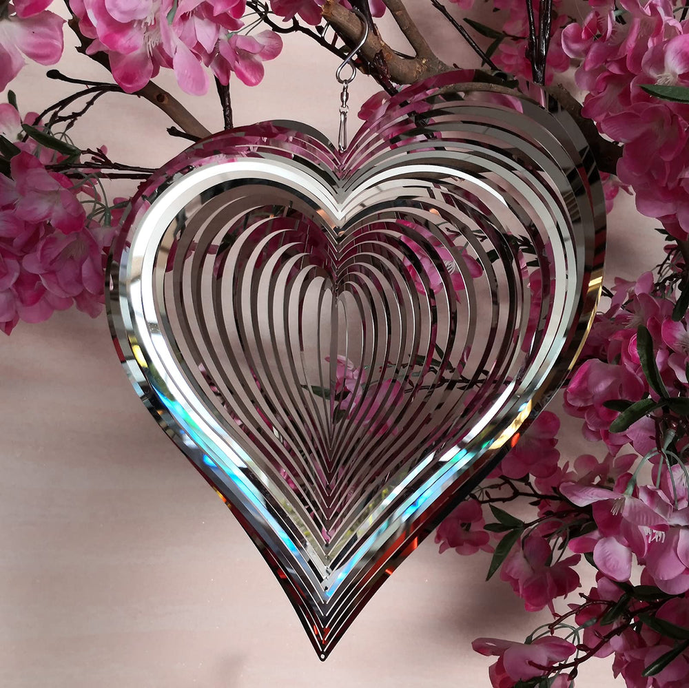 DJUAN heart wind spinner for yard decor catches attention from a distance.
