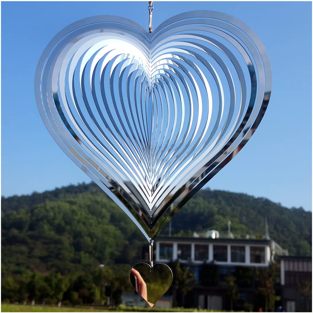 DJUAN stainless steel wind spinner heart reflecting sunlight to brighten outdoor spaces.