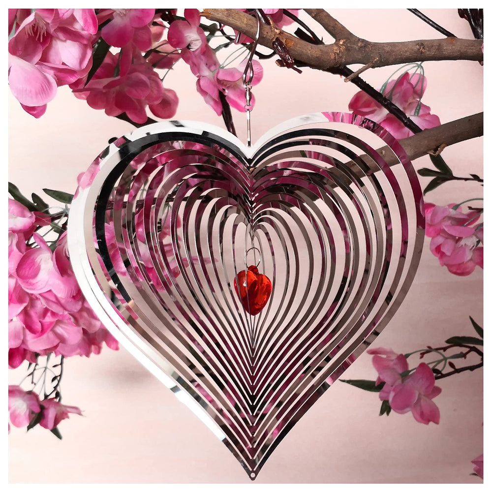 DJUAN wind spinner outdoor metal décor with mirror finish catches sunlight.