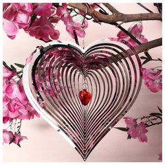 DJUAN wind spinner outdoor metal décor with mirror finish catches sunlight.