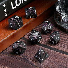 DNDND matte black dice closeup showing durable zinc alloy coating.