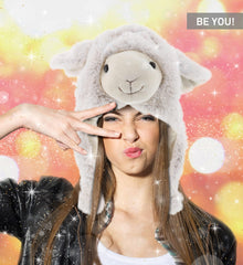 DolliBu child wearing sheep plush hat outdoors in winter.
