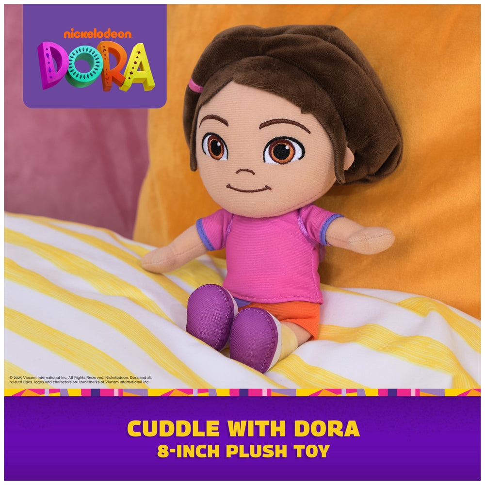 DORA plush doll shows pink shirt and purple backpack for imaginative play.
