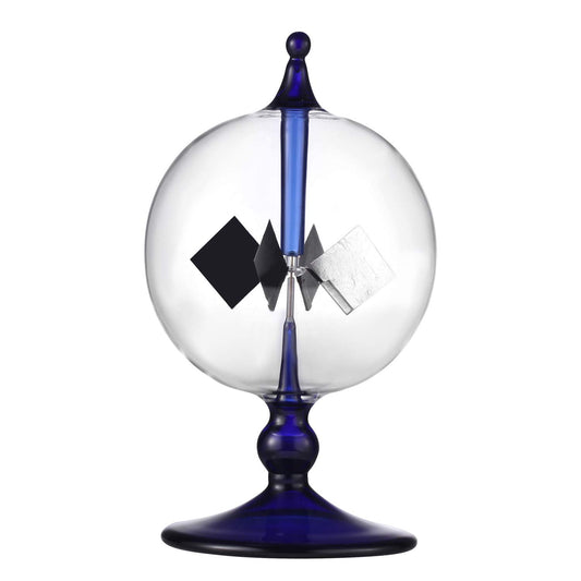 DORAMI blue solar power radiometer glass vane spins in sunlight, a kinetic desk sculpture.