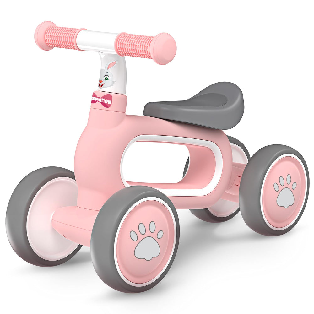 DRAMATION baby balance bike pink front view showing compact circular body for easy indoor storage.