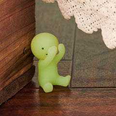Dreams Smiski glow-in-the-dark bed-cuddling figure charming night display.
