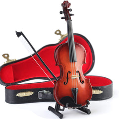 Dselvgvu violin replica on bookshelf as tasteful home decor accessory.